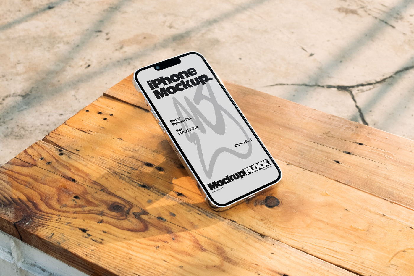 Flat lay view of a white iPhone mockup placed on a rustic wooden table under natural sunlight